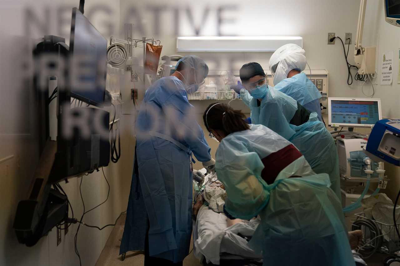 US hits ANOTHER record high day with 185k Covid cases as overwhelmed hospitals convert parking garages to treat patients