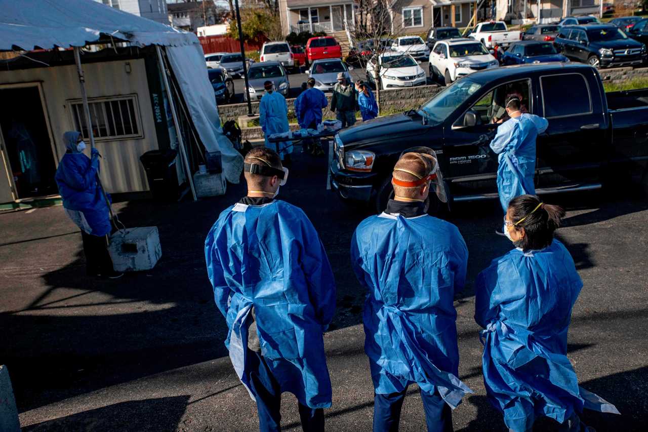 US hits ANOTHER record high day with 185k Covid cases as overwhelmed hospitals convert parking garages to treat patients