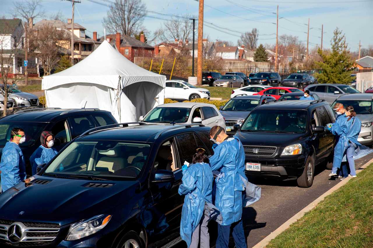 US hits ANOTHER record high day with 185k Covid cases as overwhelmed hospitals convert parking garages to treat patients