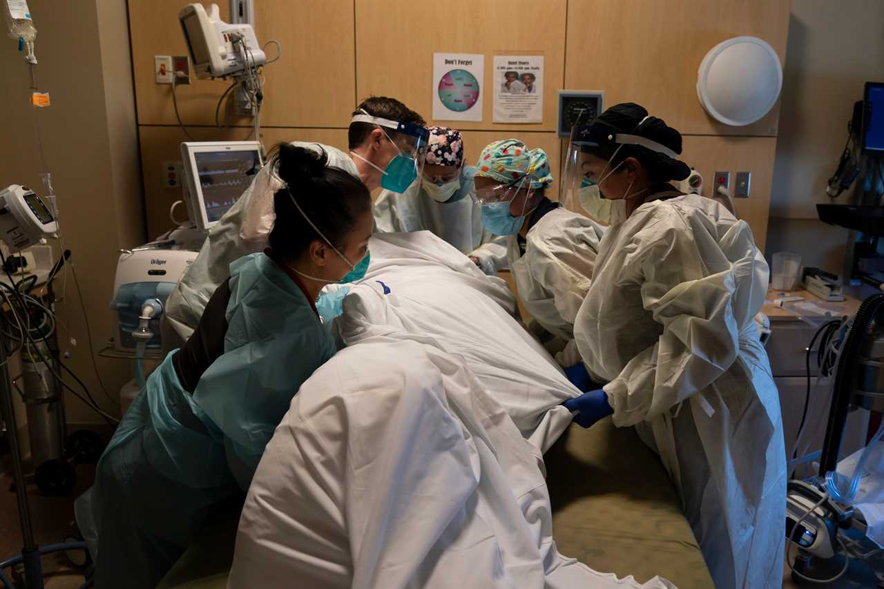 US hits ANOTHER record high day with 185k Covid cases as overwhelmed hospitals convert parking garages to treat patients