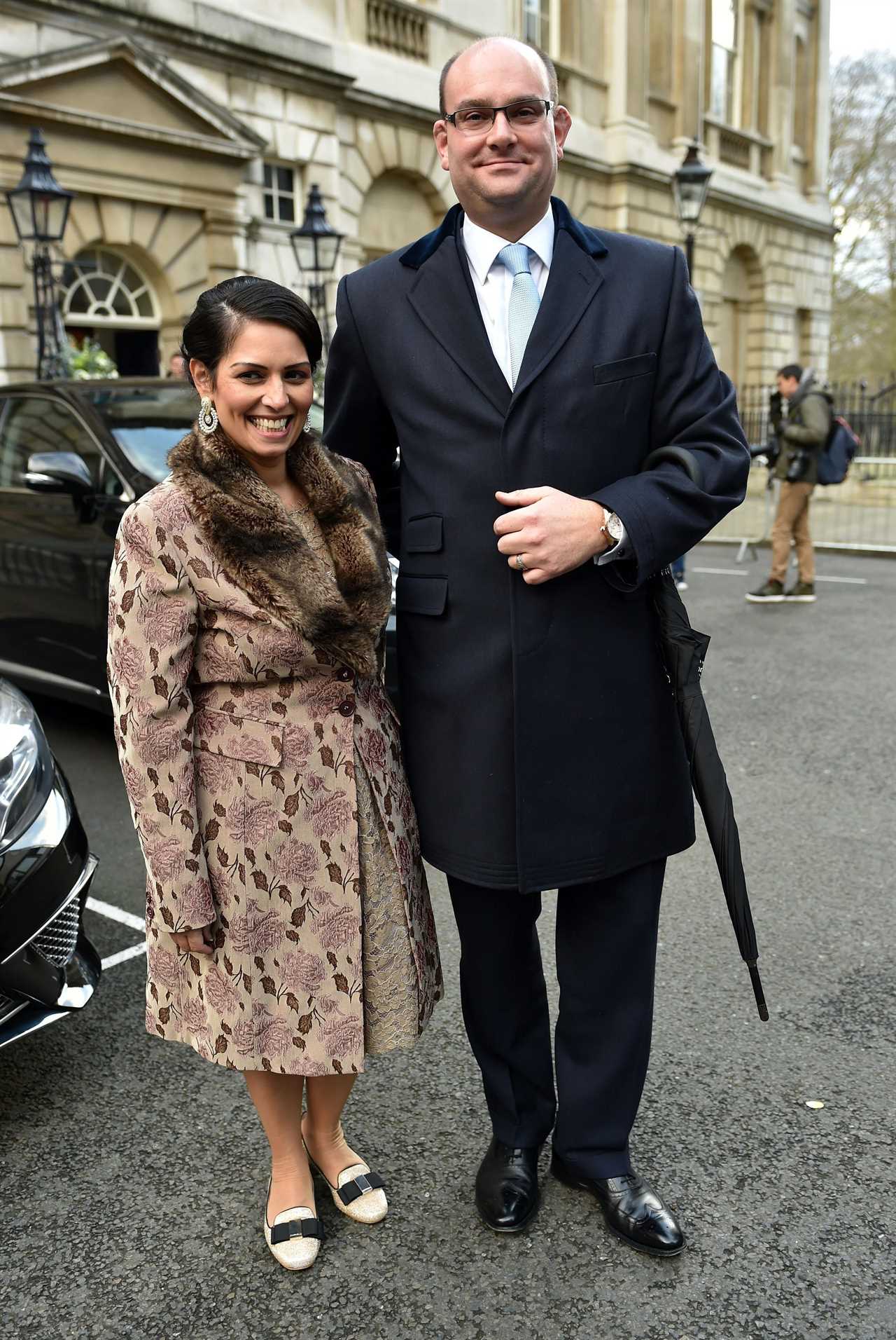 Who is Priti Patel’s husband Alex Sawyer and how many children do they have?