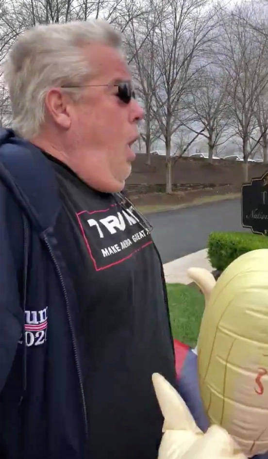 Trump supporter charged with ASSAULT ‘for forcefully exhaling on protesters’ outside president’s Virginia golf club