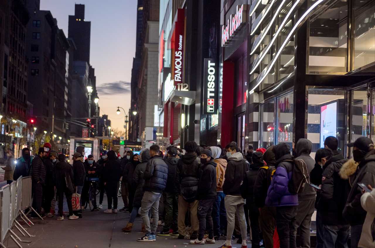 Shoppers line up for Black Friday deals despite Covid with retailers beefing up security to enforce social distancing