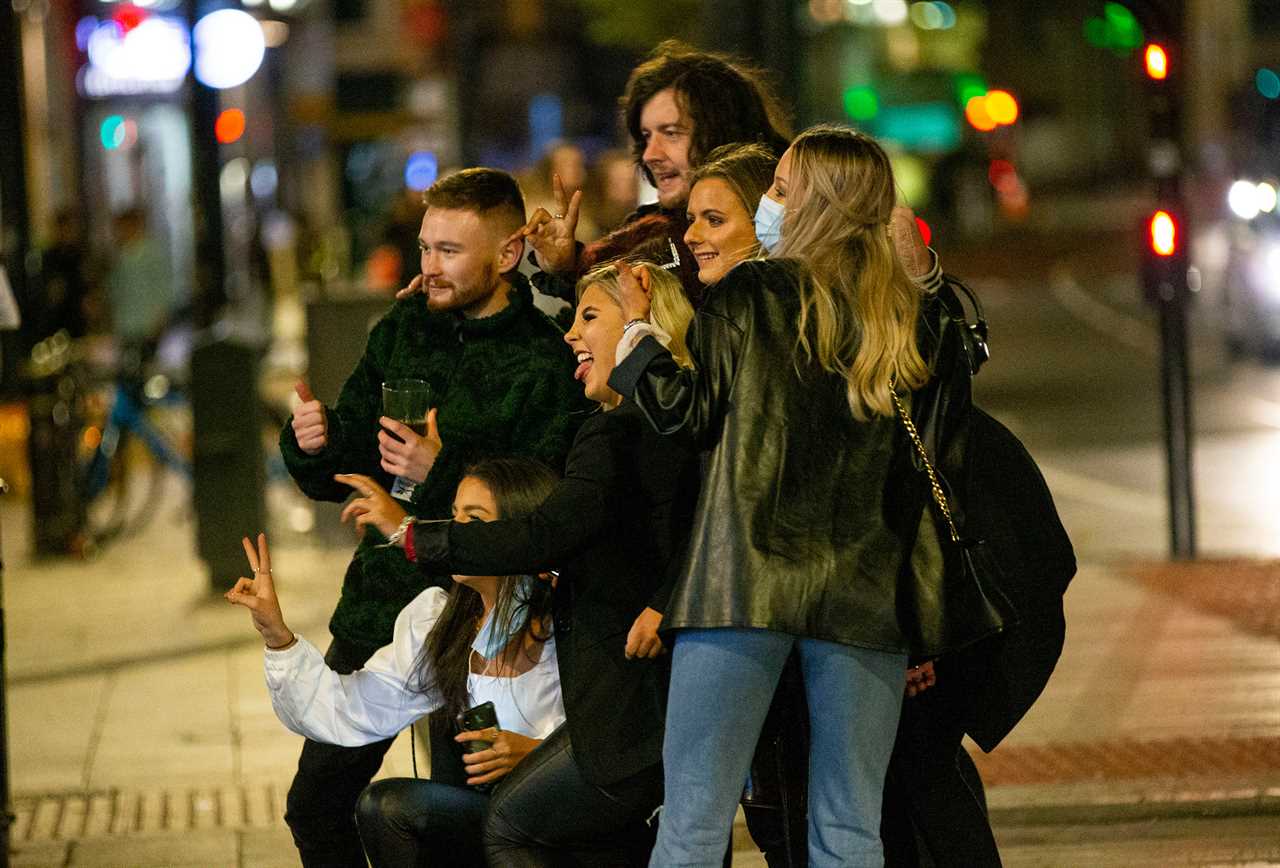 Brits hit the bars after month-long lockdown – as Tier 2 punters wrap up for drinks al fresco