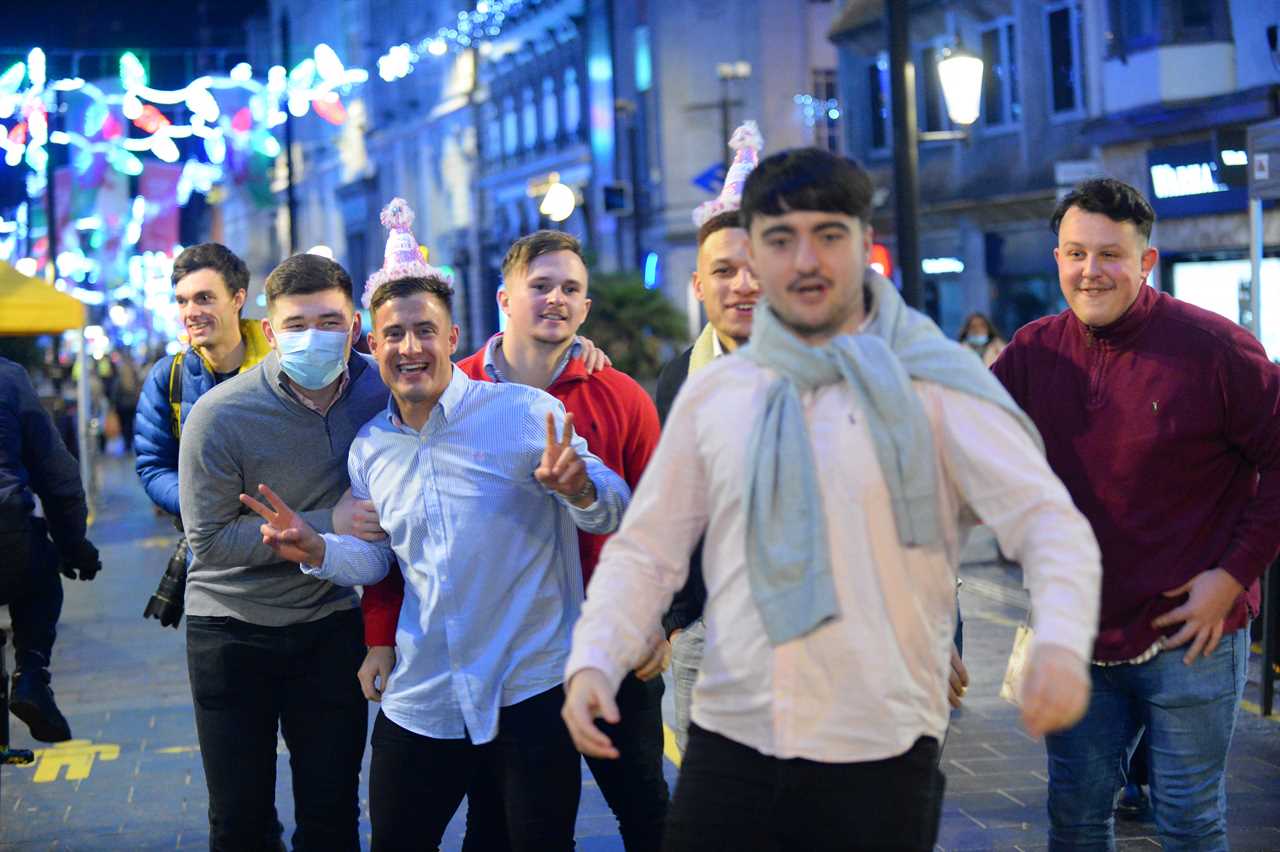 Boozers hit the town in first night of Friday fun since Covid lockdown as Welsh drinkers are booted out of bars at 6pm