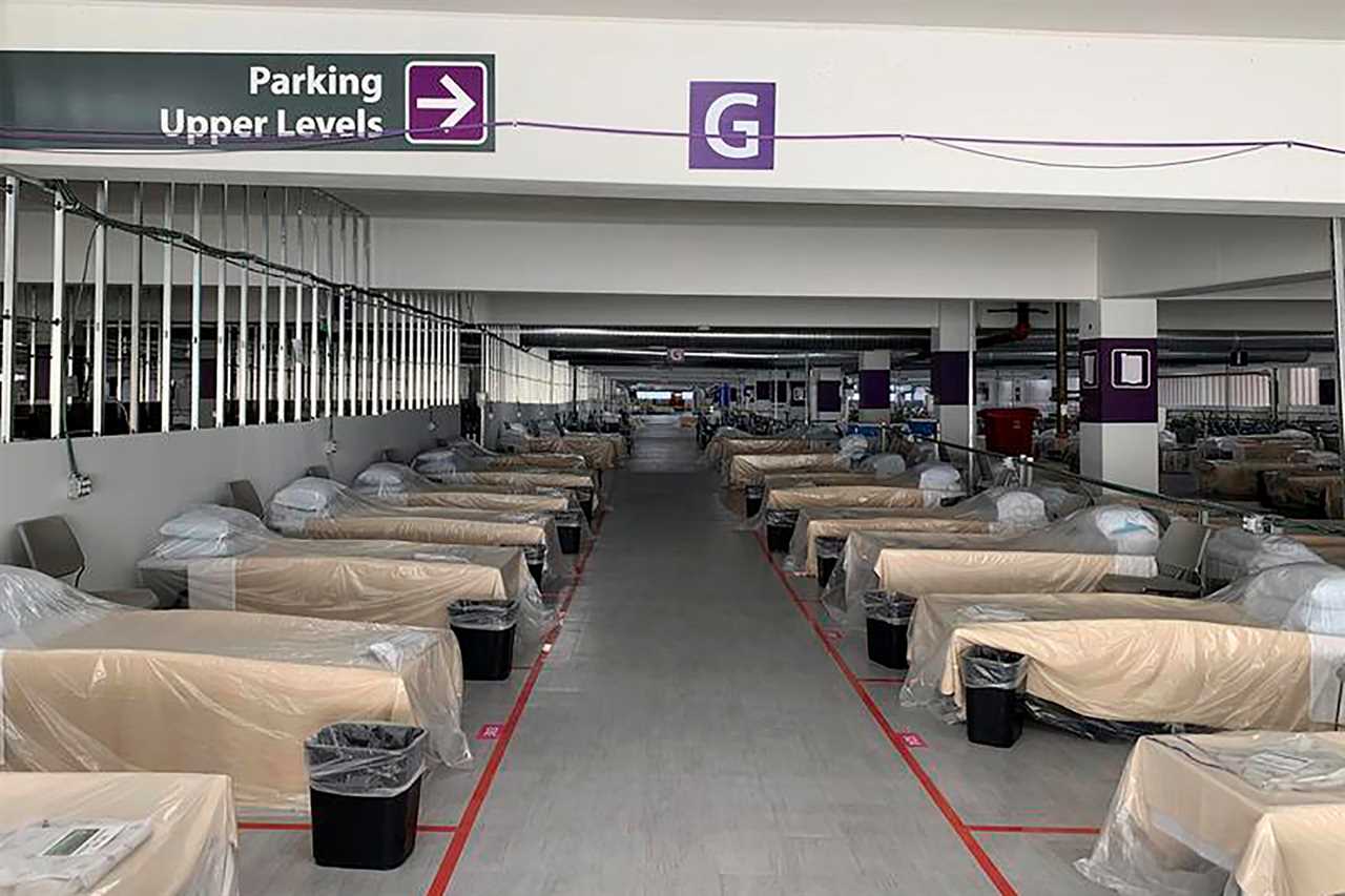 US Covid cases soar past 15 million as hospital forced to treat patients in underground parking lot