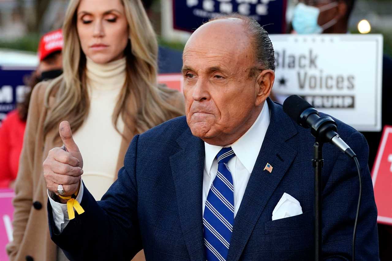 Rudy Giuliani gives thumbs up leaving hospital after Covid scare amid claims Trump’s pals are getting special treatment