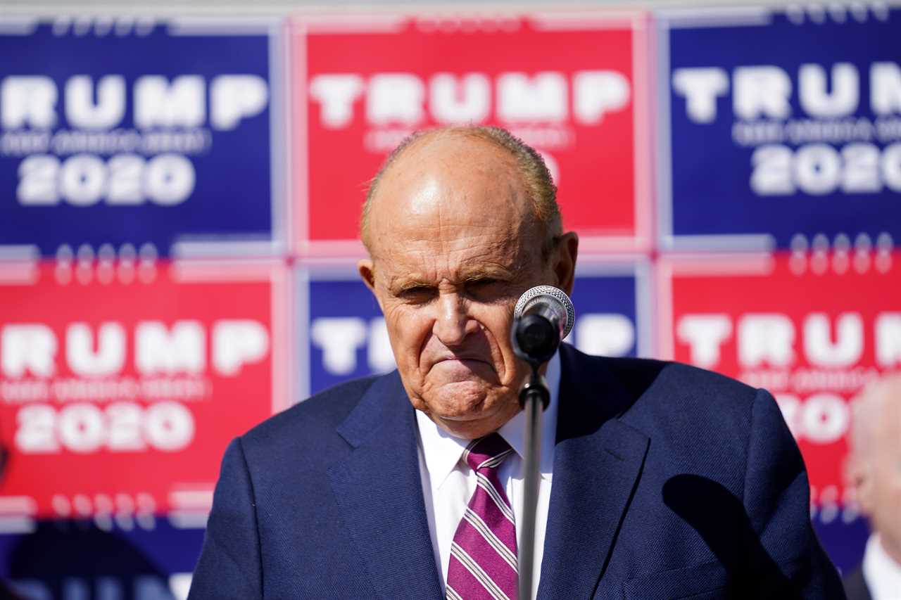 Rudy Giuliani gives thumbs up leaving hospital after Covid scare amid claims Trump’s pals are getting special treatment