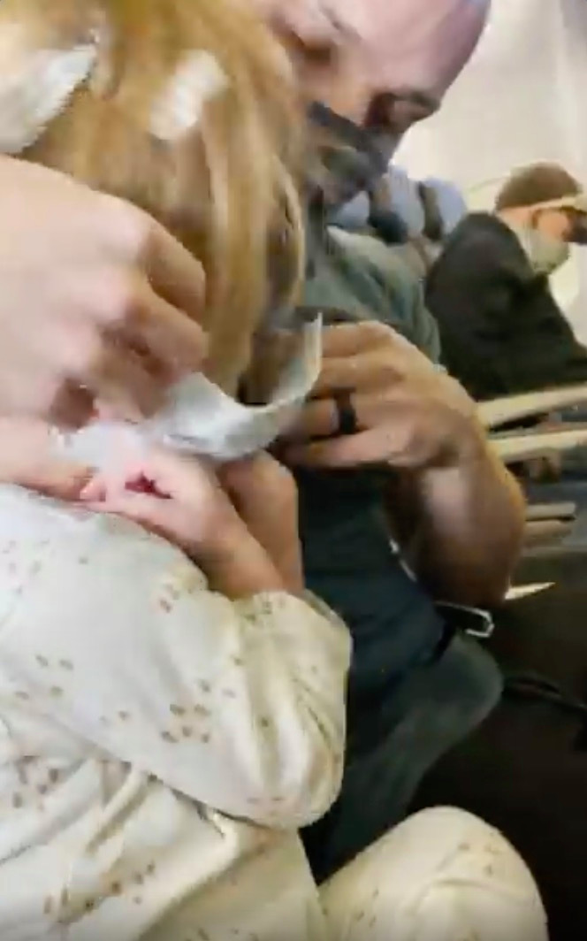 Family kicked off United Airlines flight and banned for life because crying toddler refused to wear Covid mask