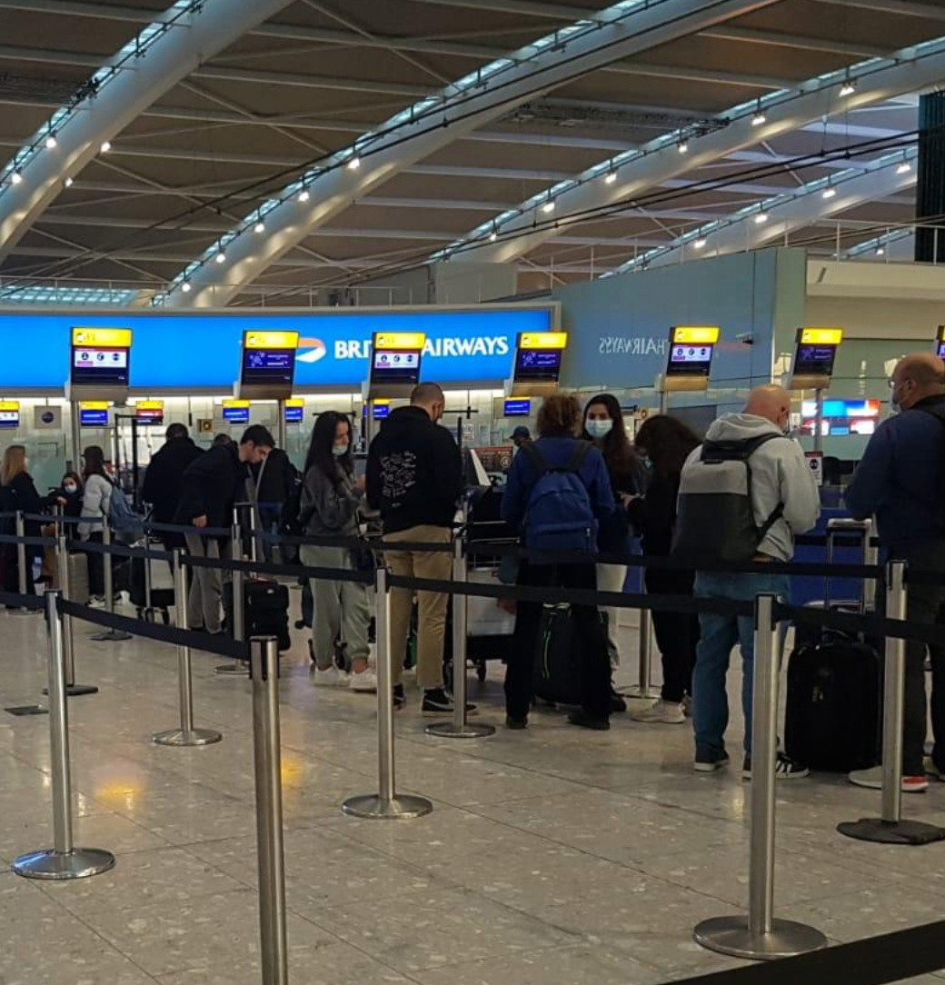 Covid fears at Heathrow after pictures show passengers packed together in snaking queues as Christmas getaway begins