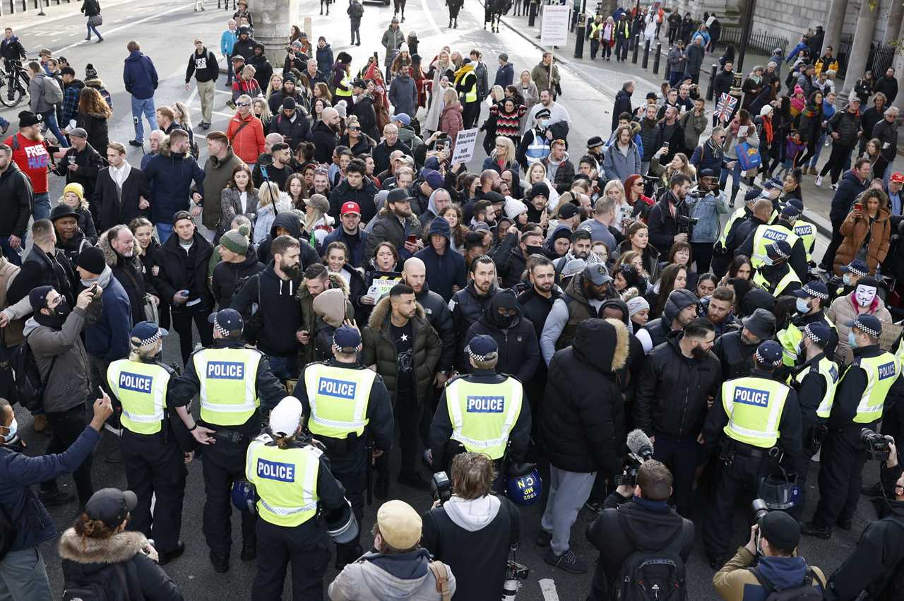 Chaos as 10 cops struggle to arrest huge bodybuilder who refused to close gym as anti-lockdown protest turns violent