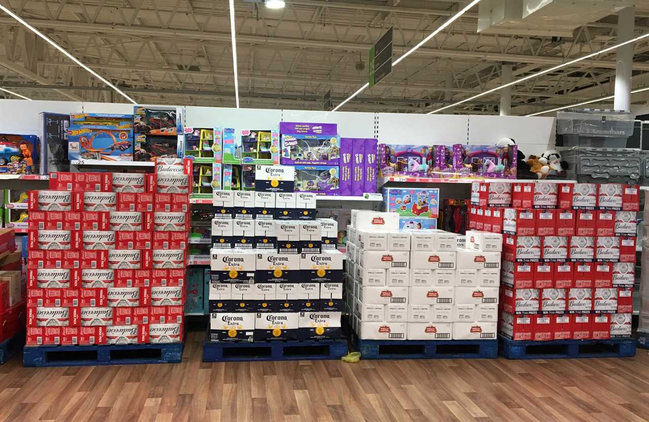 Toys - regarded as non-essential - are blocked off by piles of alcohol in Asda, Coryton, Cardiff