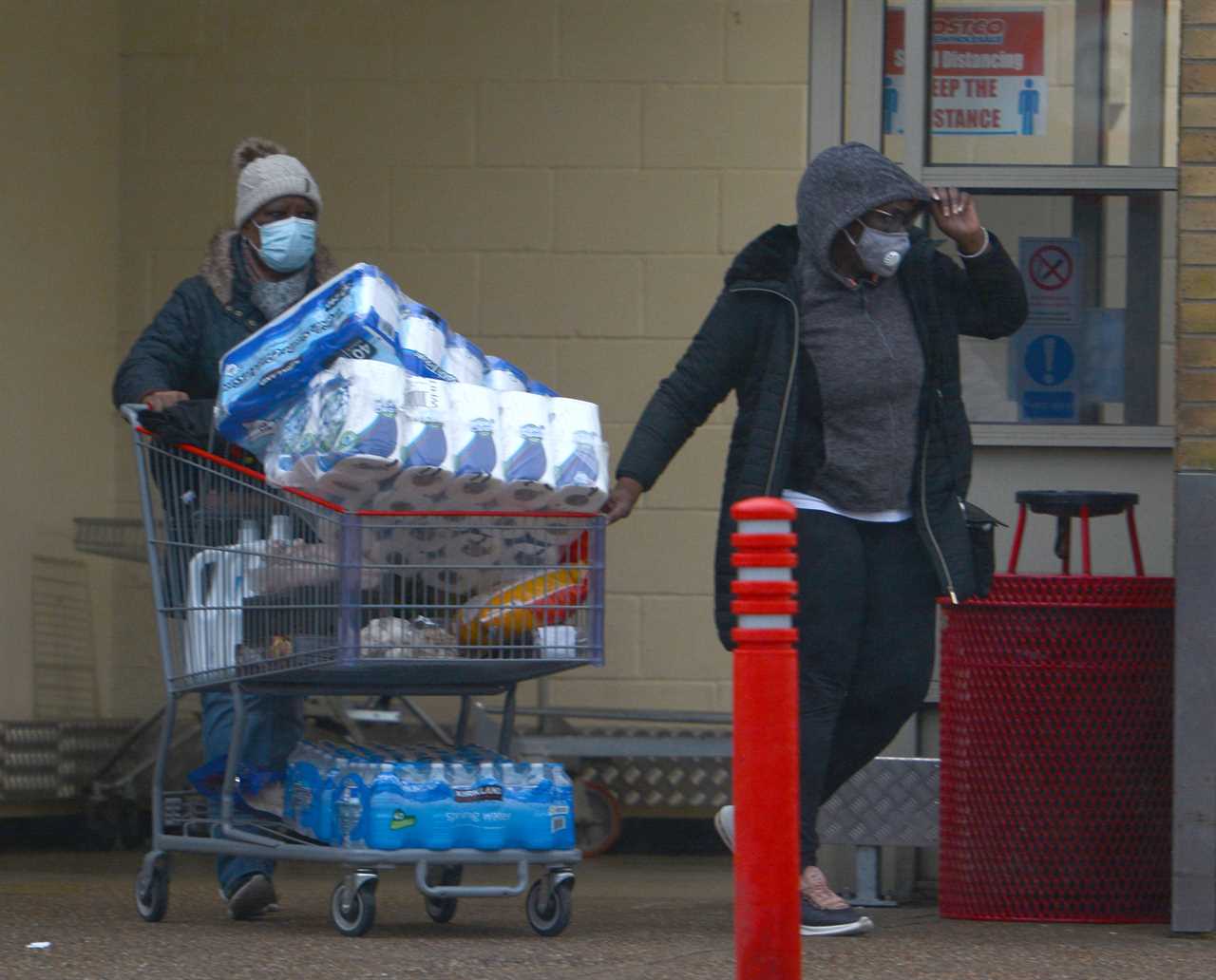 Panic-buyers queue around the block in rain to stockpile last-minute Christmas food amid ‘rationing’