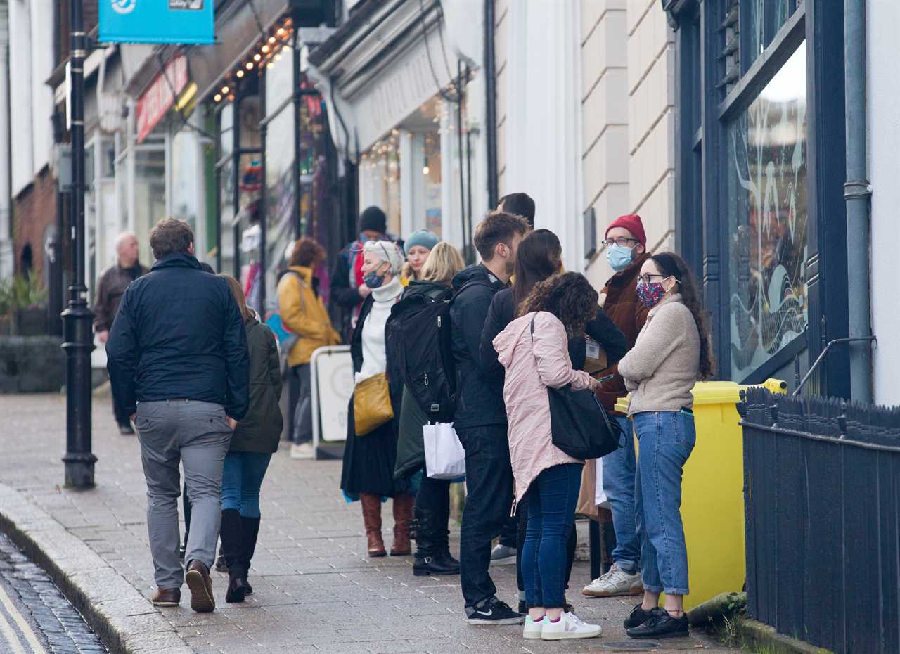 Panic-buyers queue around the block in rain to stockpile last-minute Christmas food amid ‘rationing’