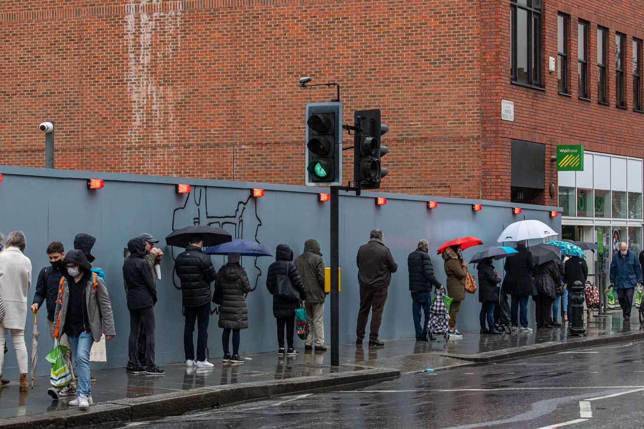 Panic-buyers queue around the block in rain to stockpile last-minute Christmas food amid ‘rationing’