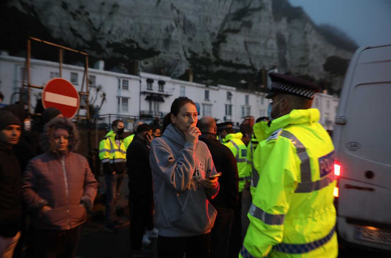Rage boils over at Dover port as drivers from 4,000 waiting lorries push cops as Macron backs down to reopen border