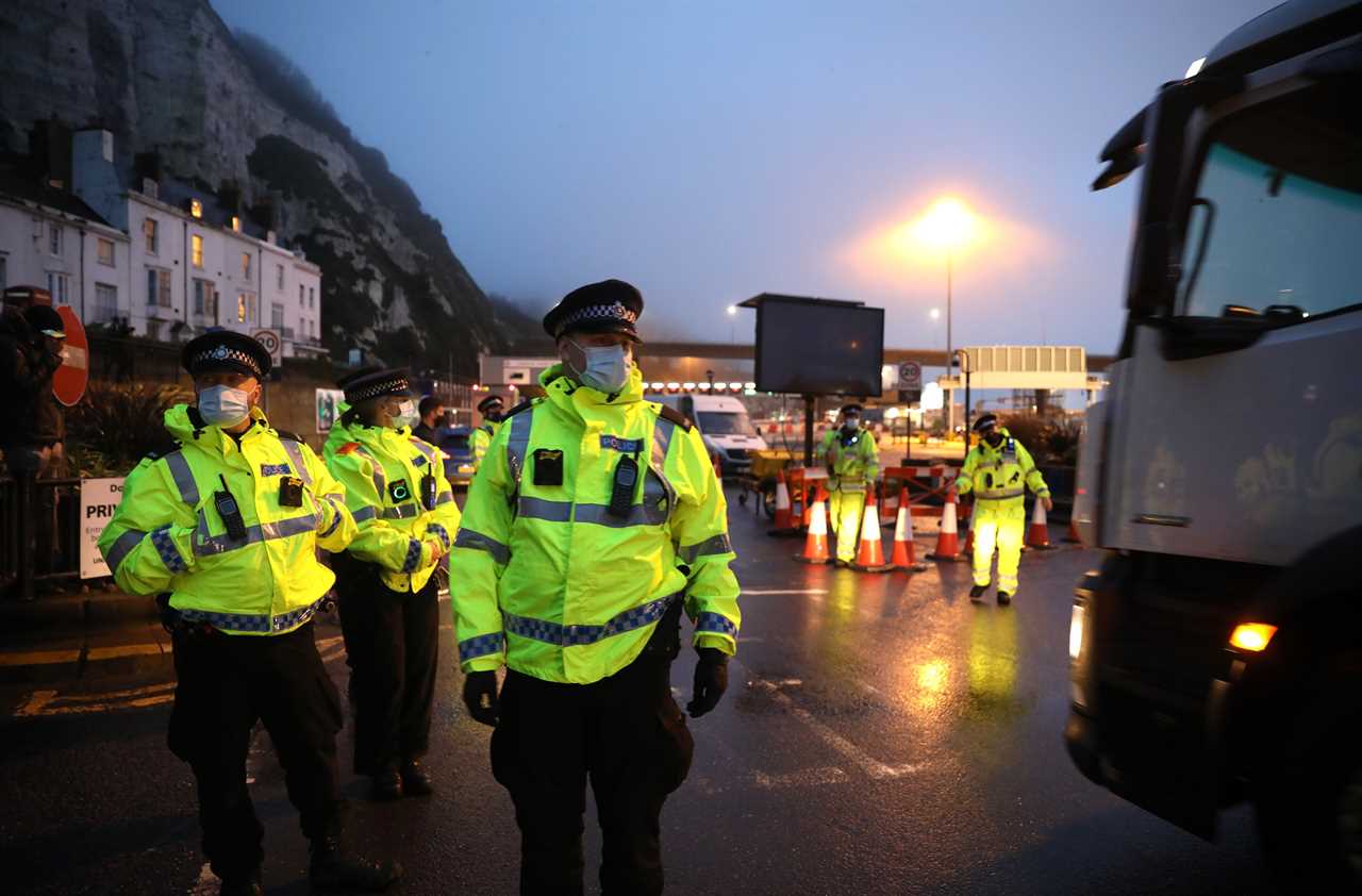 Rage boils over at Dover port as drivers from 4,000 waiting lorries push cops as Macron backs down to reopen border