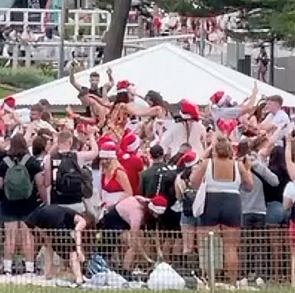 Hundreds of backpackers pictured breaking Covid rules at Christmas beach party in Australia face being deported