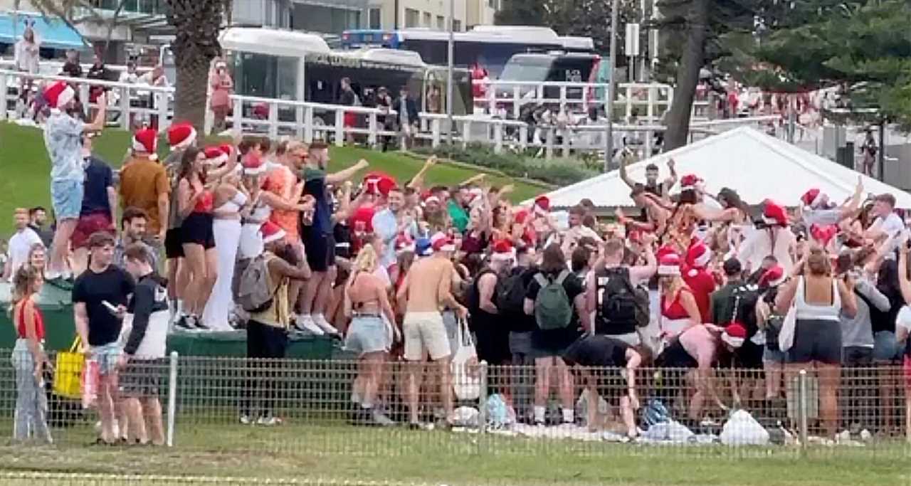 Hundreds of backpackers pictured breaking Covid rules at Christmas beach party in Australia face being deported