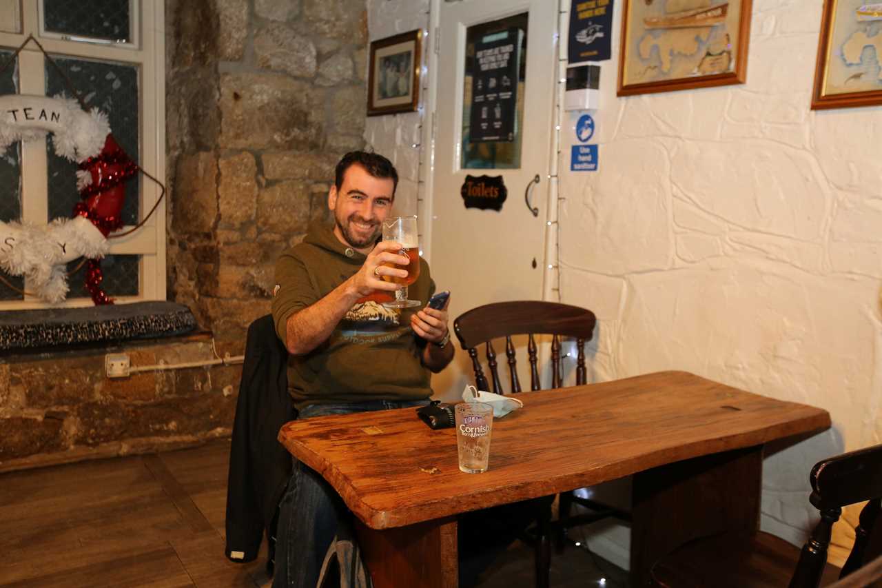 Punters on Scilly Isles toast New Year in the only pubs still open in Britain