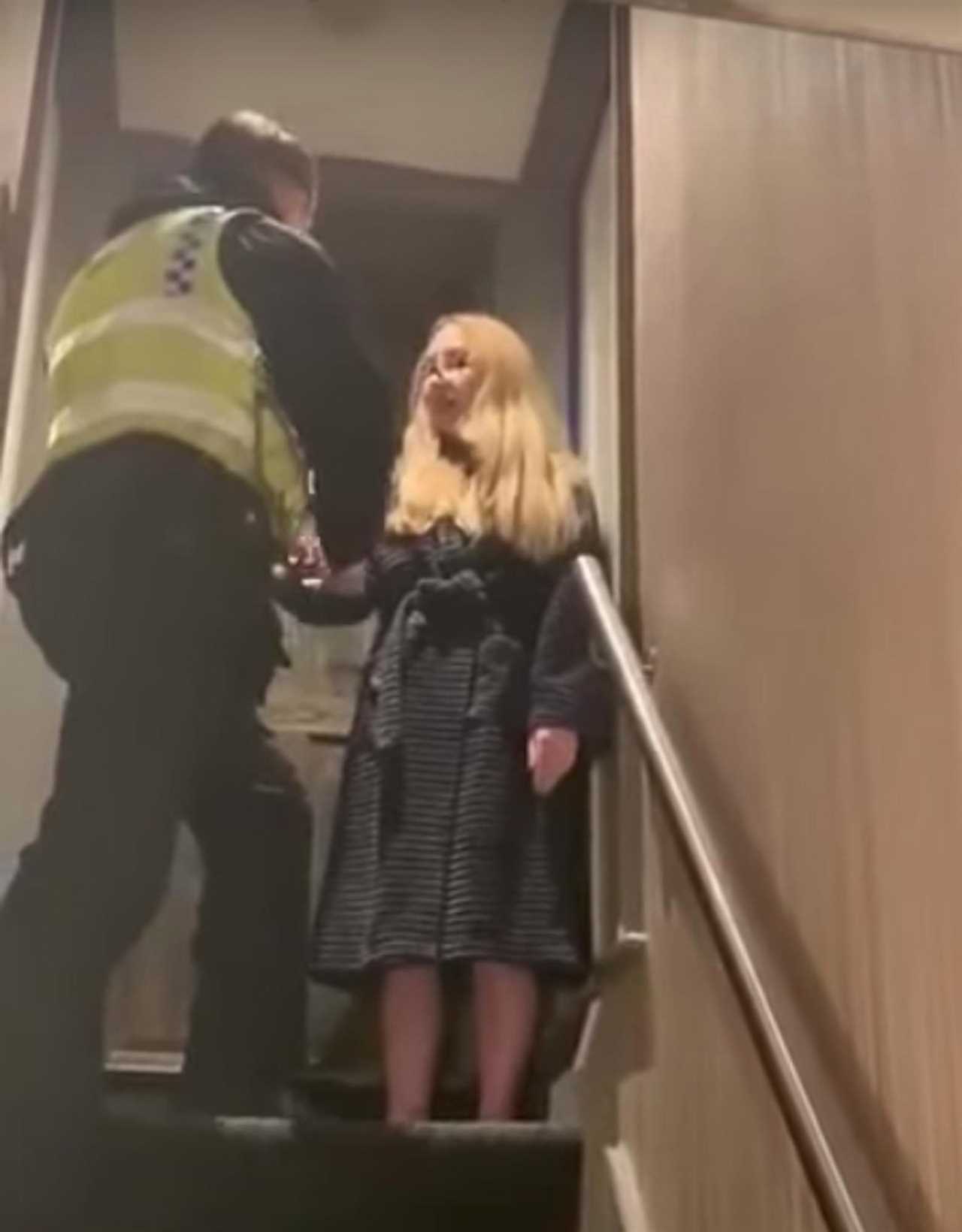 Moment anti-Covid lockdown activist who filmed ’empty’ hospital wards is arrested in her dressing gown