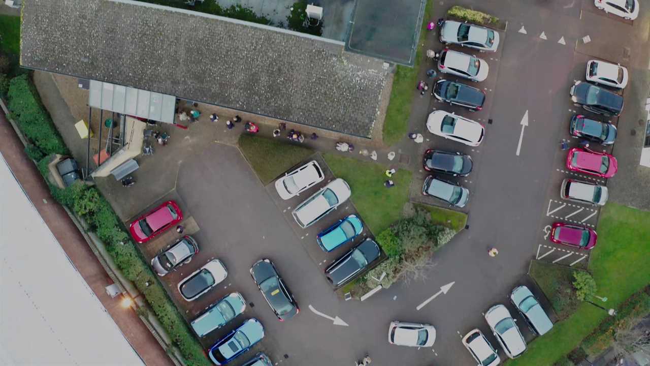 Drone footage shows long queue of people waiting to get Covid vaccine