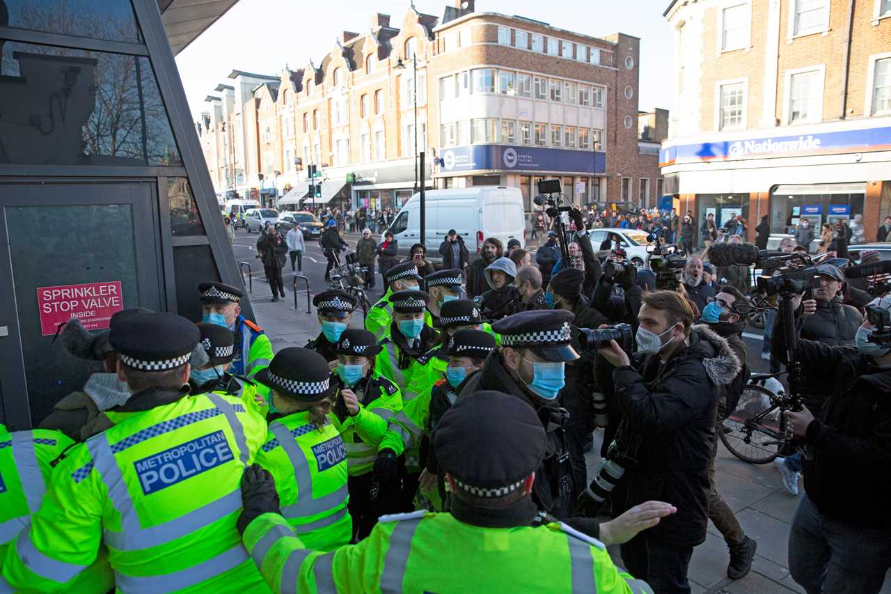 ‘Idiot’ anti-lockdown protesters clash with police 24 hours after Covid killed 1,325 on Britain’s deadliest day