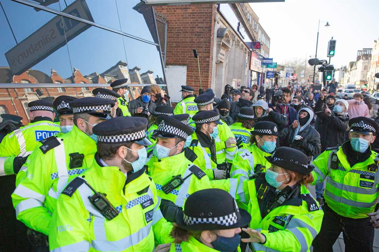 ‘Idiot’ anti-lockdown protesters clash with police 24 hours after Covid killed 1,325 on Britain’s deadliest day