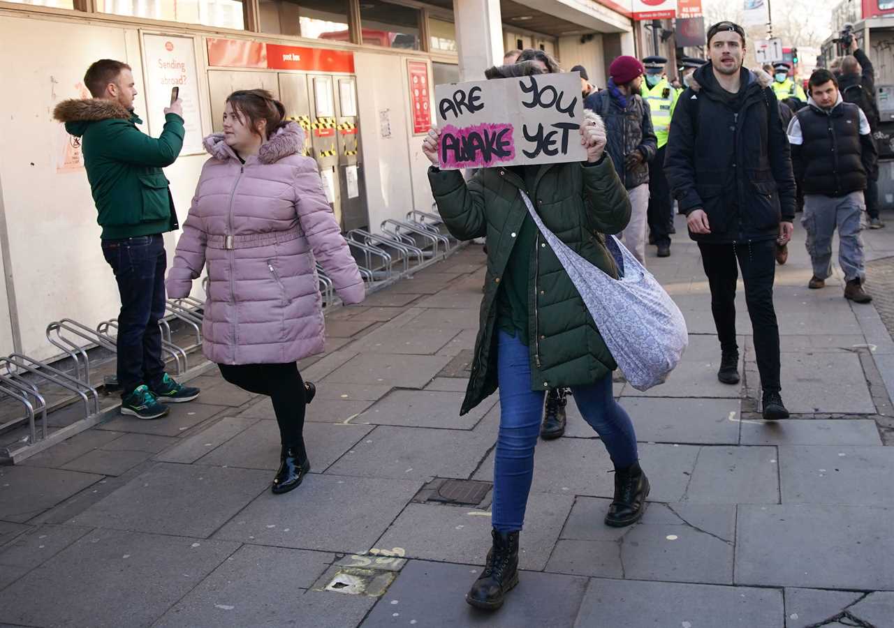 ‘Idiot’ anti-lockdown protesters clash with police 24 hours after Covid killed 1,325 on Britain’s deadliest day