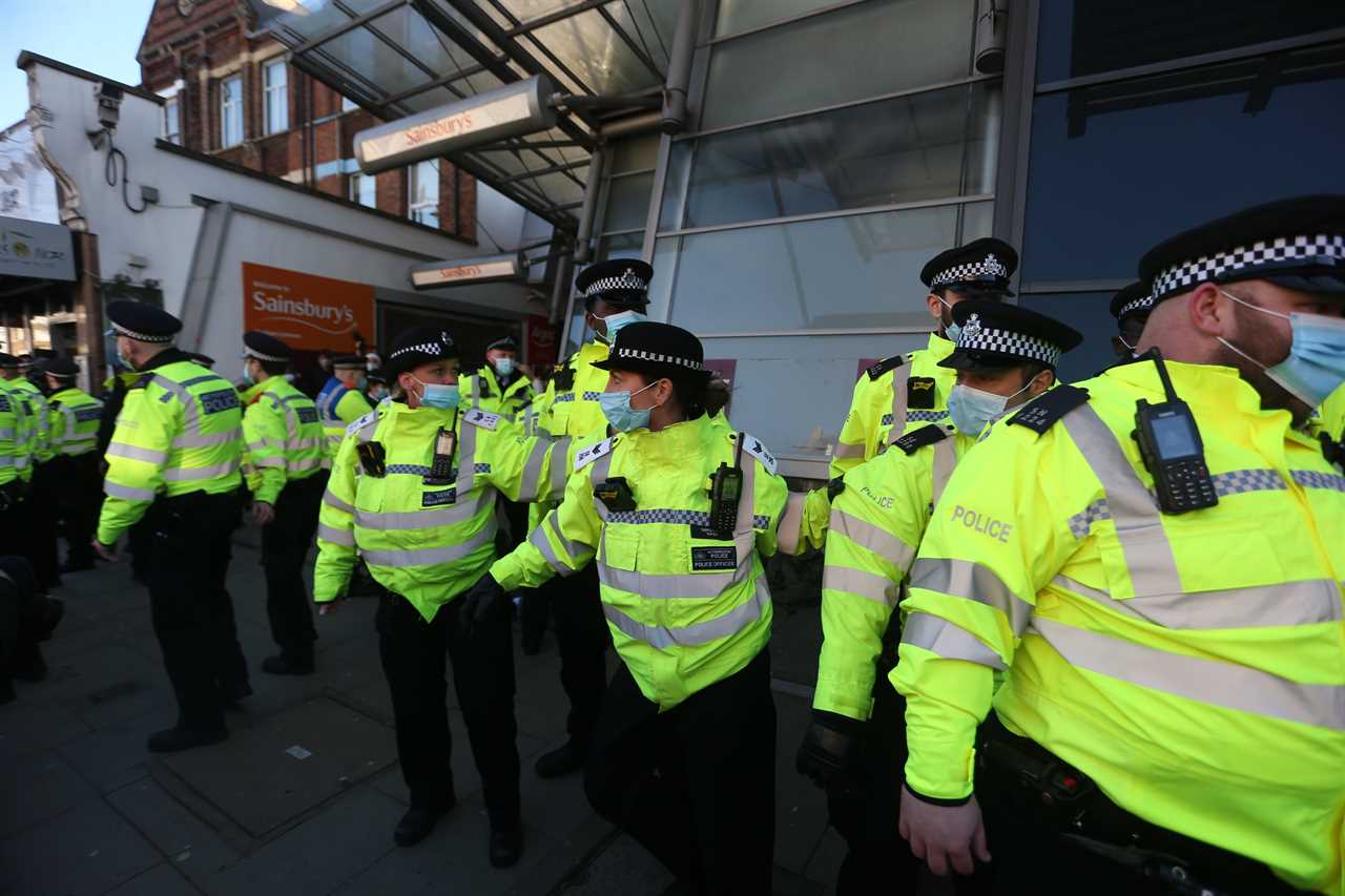 ‘Idiot’ anti-lockdown protesters clash with police 24 hours after Covid killed 1,325 on Britain’s deadliest day