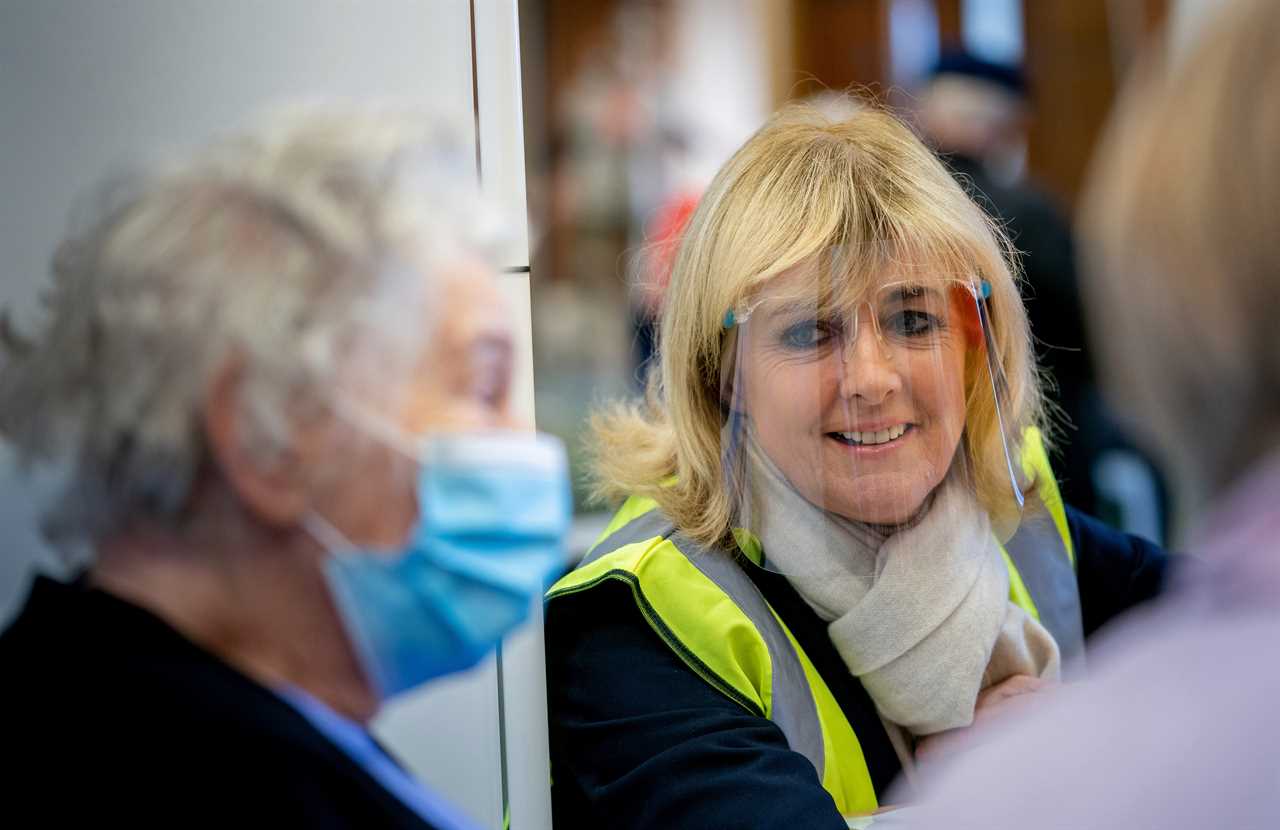 It’s freezing outside but inside Epsom vaccination centre there’s a glow of hope