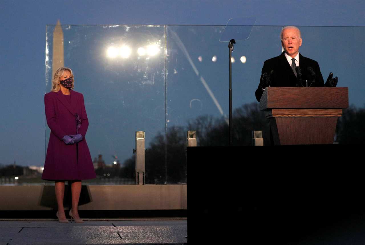 Joe Biden and Kamala Harris pay tribute to Covid victims and light lanterns at National Mall as death toll passes 400K