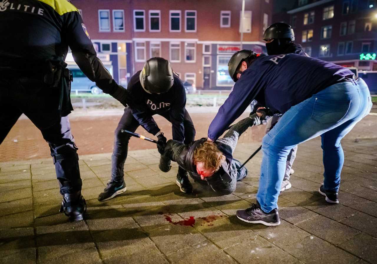 Anti-lockdown RIOTS as youths loot shops, flip cars and torch buildings over Covid curfew in the Netherlands