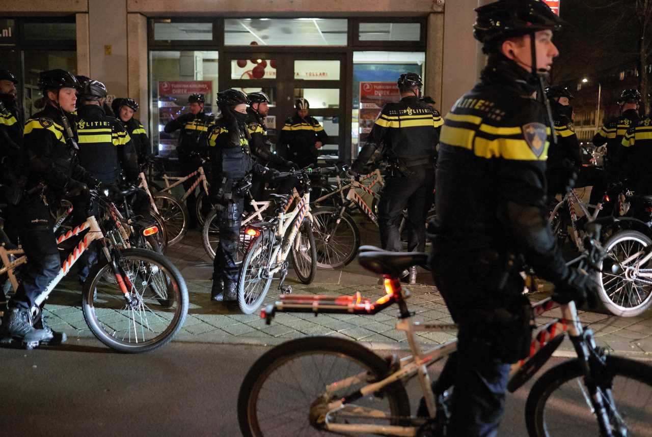 Anti-lockdown RIOTS as youths loot shops, flip cars and torch buildings over Covid curfew in the Netherlands