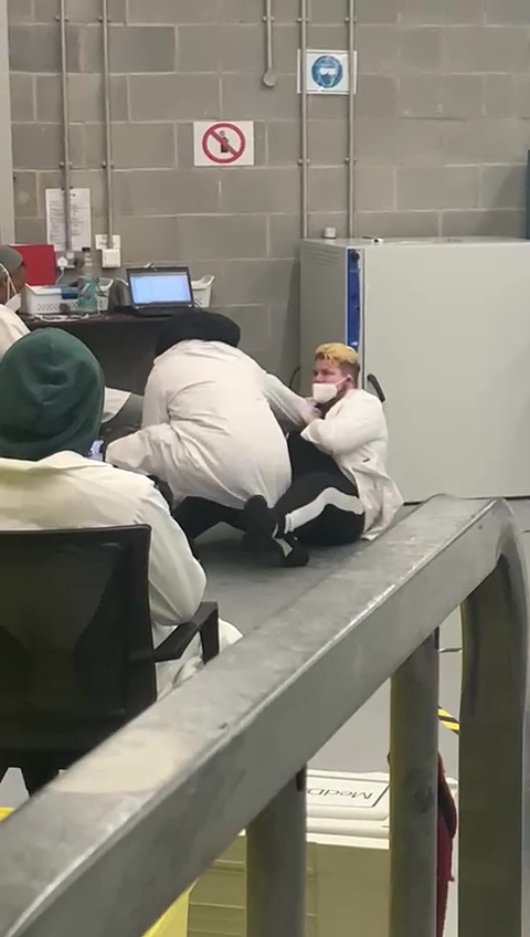 Workers at Covid testing centre shown ‘fighting, boozing and snoozing’ in shocking video