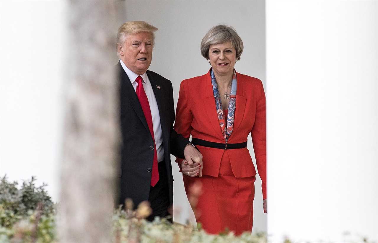 Worried Theresa May phoned her husband to say she was snapped holding hands with Donald Trump