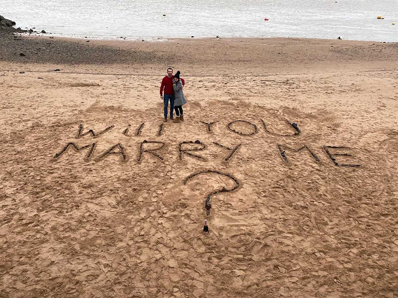 Romantic proposed by writing ‘Will you marry me?’ on his local beach after Covid wrecked plan to pop question in Italy