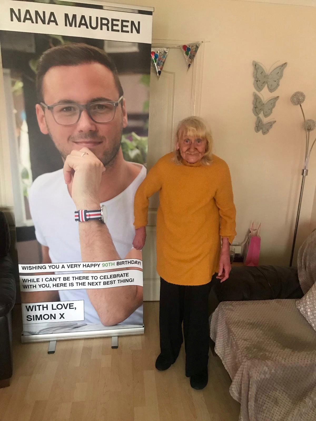 Grandson surprises nan with huge banner of his face to celebrate her 90th birthday