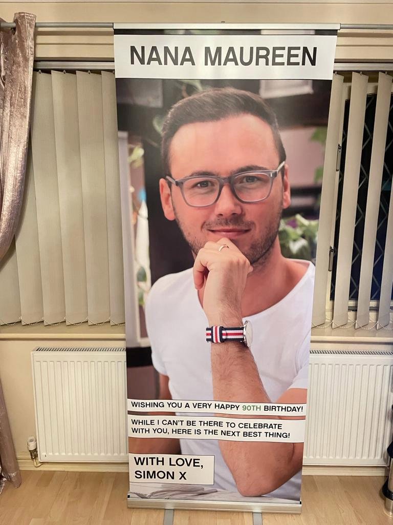 Grandson surprises nan with huge banner of his face to celebrate her 90th birthday