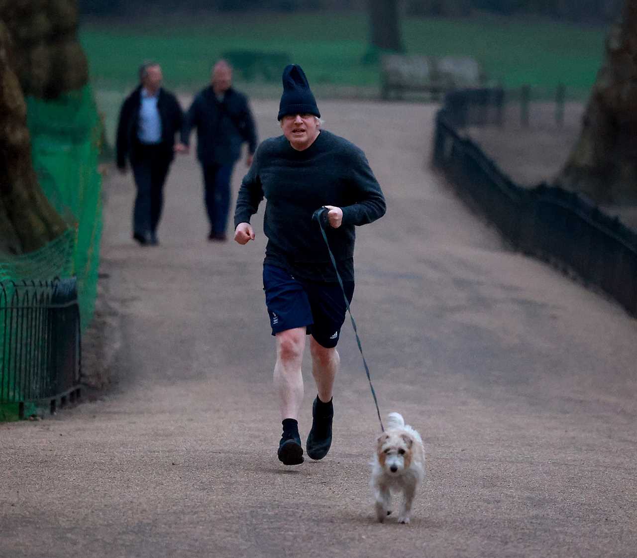 Boris Johnson dons his woolly hat as he heads out for a run with dog Dilyn