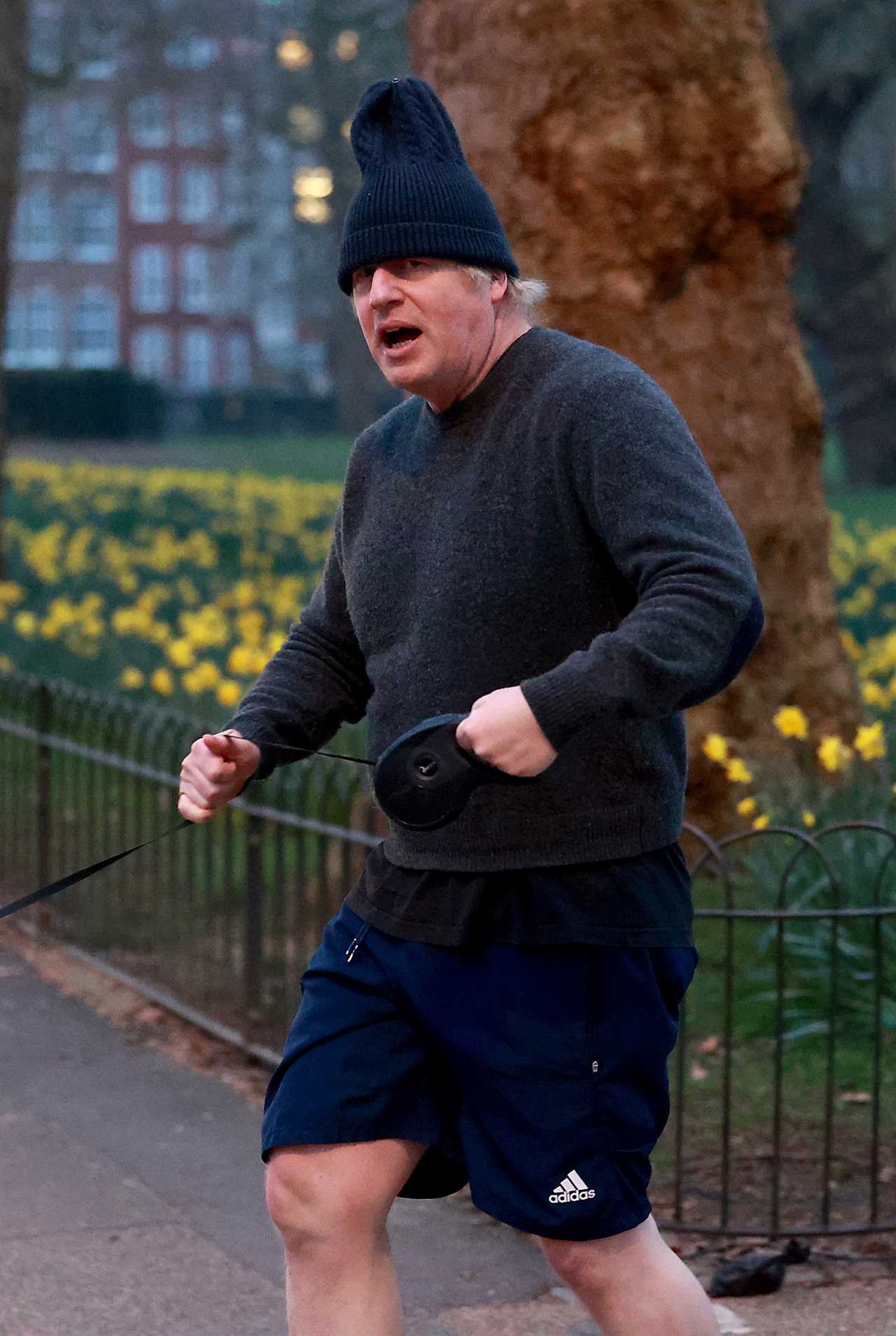 Boris Johnson dons his woolly hat as he heads out for a run with dog Dilyn