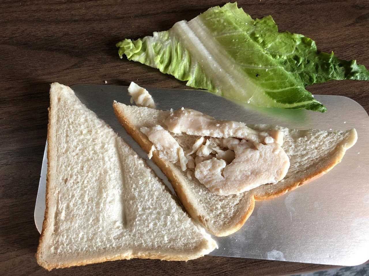 Man in hotel quarantine furious after being served frozen chicken sandwich and kids size meals