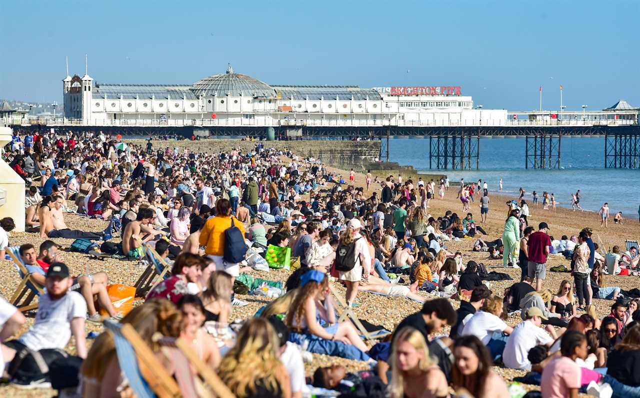 Brighton beach is packed as visitors flock to the seaside on the hottest day of the year so far