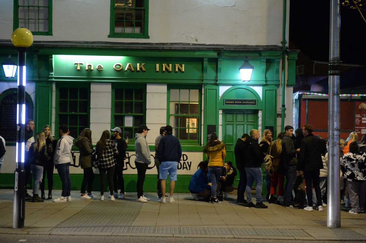 Joy as pubs in England reopen with punters queuing up to get their first pints in months