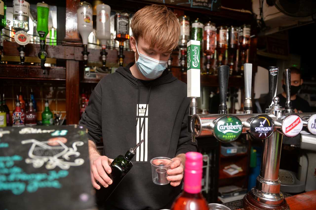 Joy as pubs in England reopen with punters queuing up to get their first pints in months