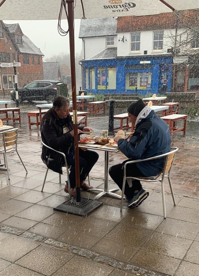 Thirsty Brits brave SNOW & queue from midnight in -3C temperatures as pub beer gardens reopen for first time in months