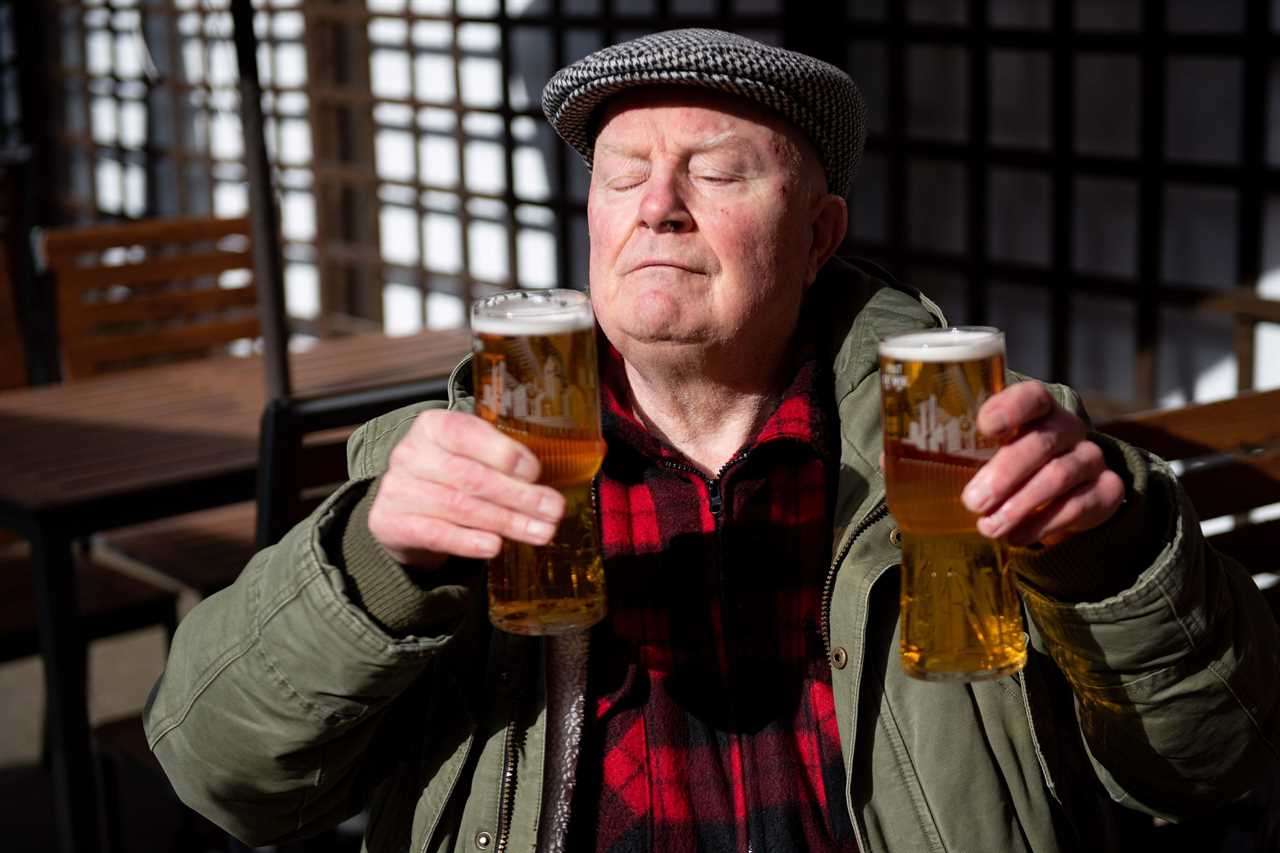 Thirsty Brits brave SNOW & queue from midnight in -3C temperatures as pub beer gardens reopen for first time in months