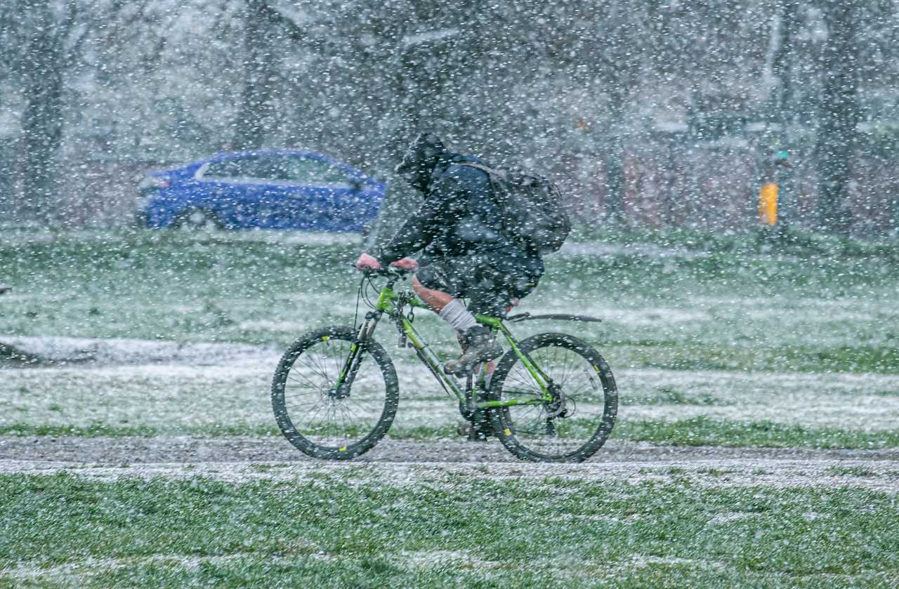 Thirsty Brits brave SNOW & queue from midnight in -3C temperatures as pub beer gardens reopen for first time in months