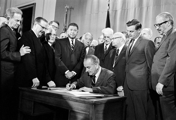 Mr. Mondale represented Minnesota for 12 years in the Senate. Mr. Mondale, second from right, was on hand when President Lyndon B. Johnson signed an open housing bill in 1968.