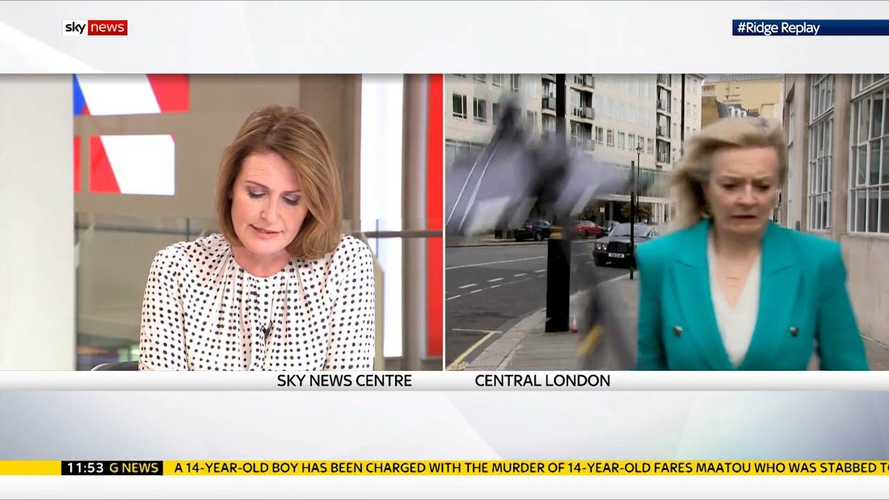 Moment Trade Secretary Liz Truss almost hit on head by falling tripod during live Sky TV interview